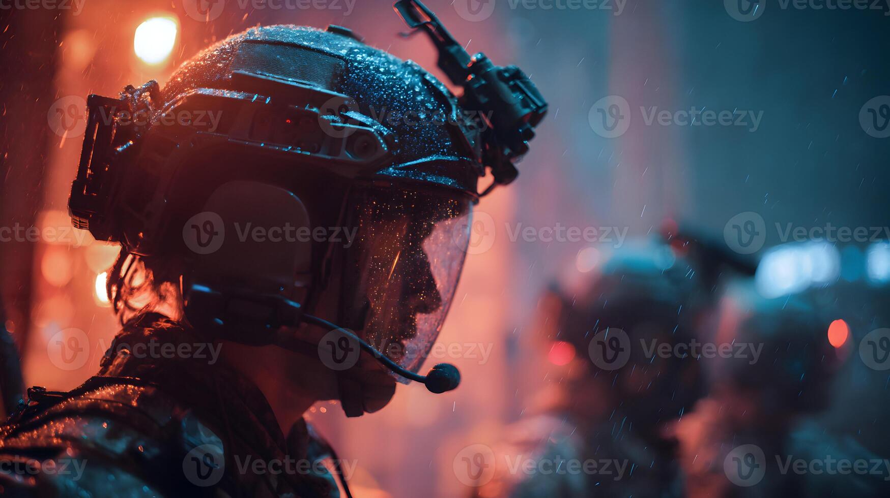 A soldier clad in tactical gear stands resiliently amidst a heavy downpour during a nighttime operation photo