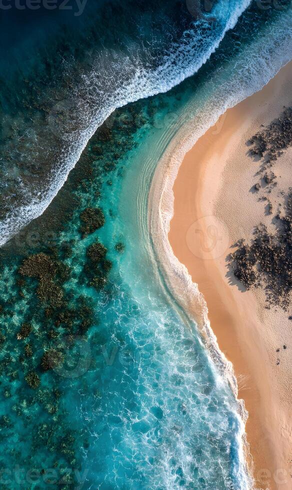 Aerial view of a tropical beach with turquoise water and golden sand, a serene paradise photo