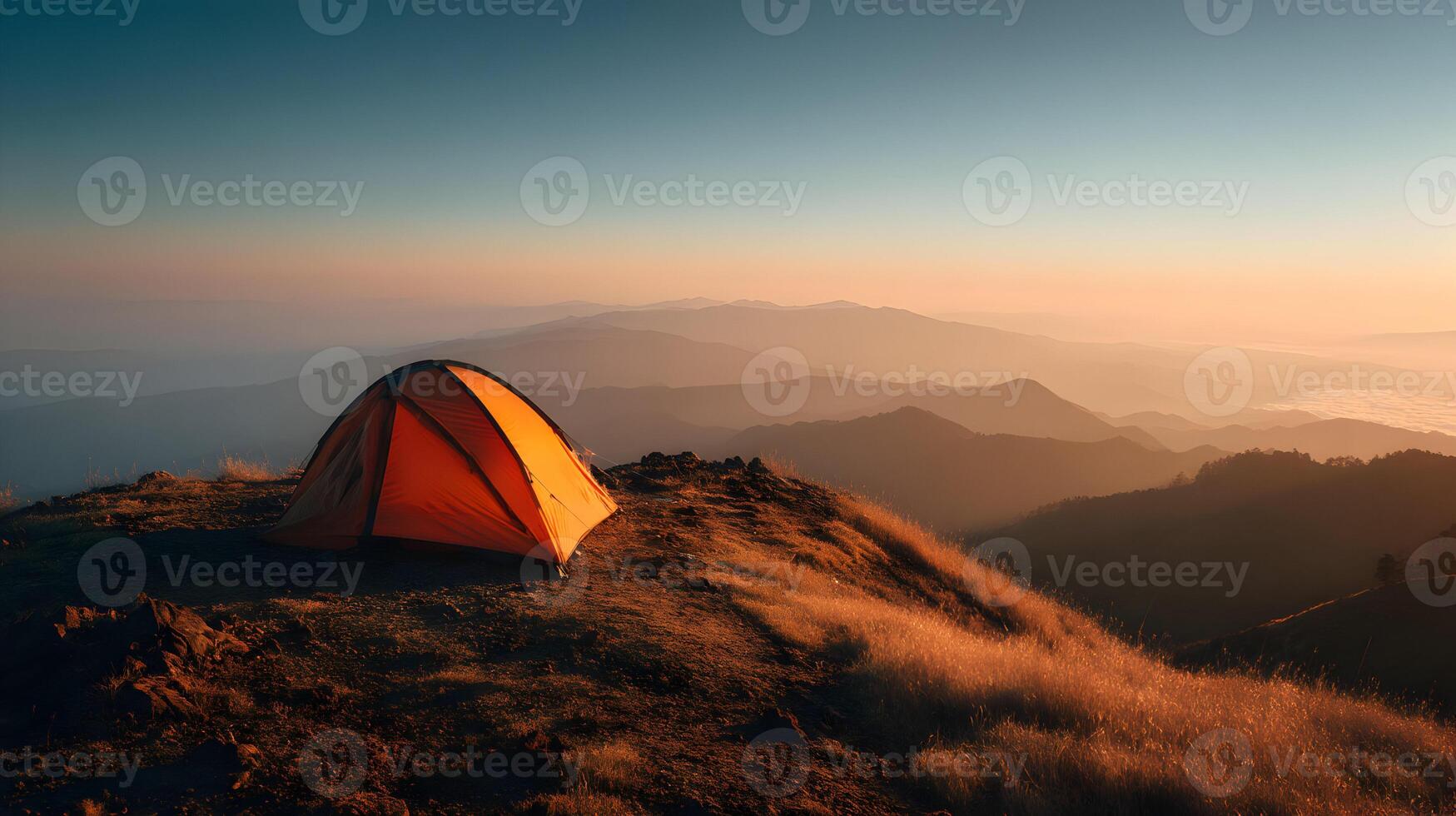 Scenic mountain view with camping tent during sunrise, capturing adventure in nature photo