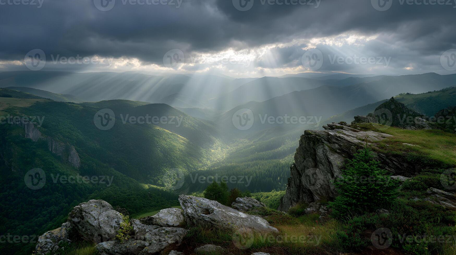 Dramatic mountain landscape with sun rays piercing through storm clouds casting shadows photo