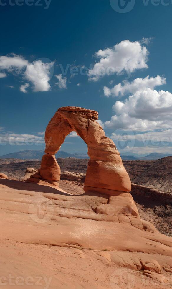 Majestic Delicate Arch standing tall against the blue sky in Arches National Park Utah photo
