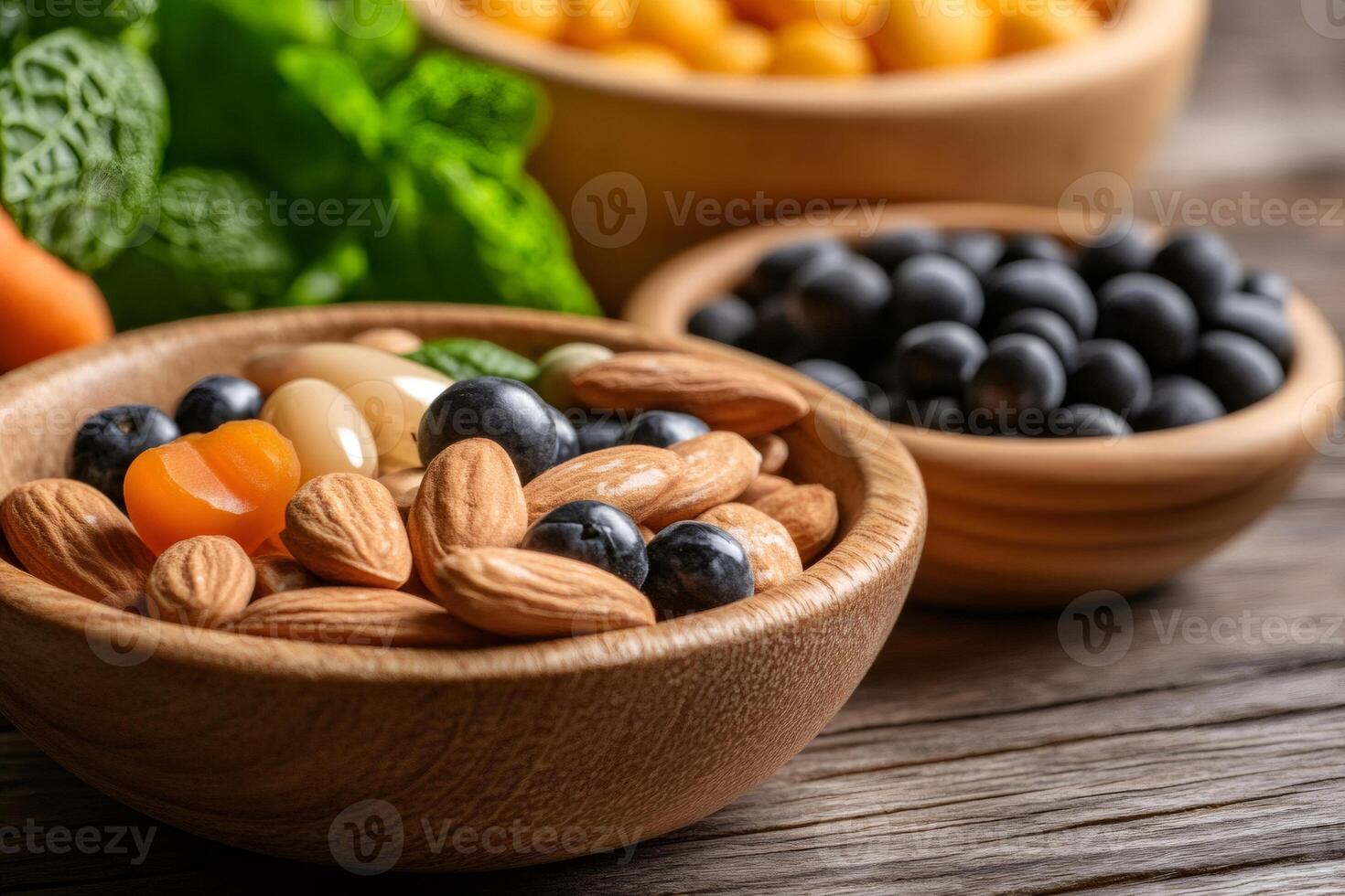 Wooden bowls overflowing with healthy nuts, berries, and dried fruit on rustic table photo