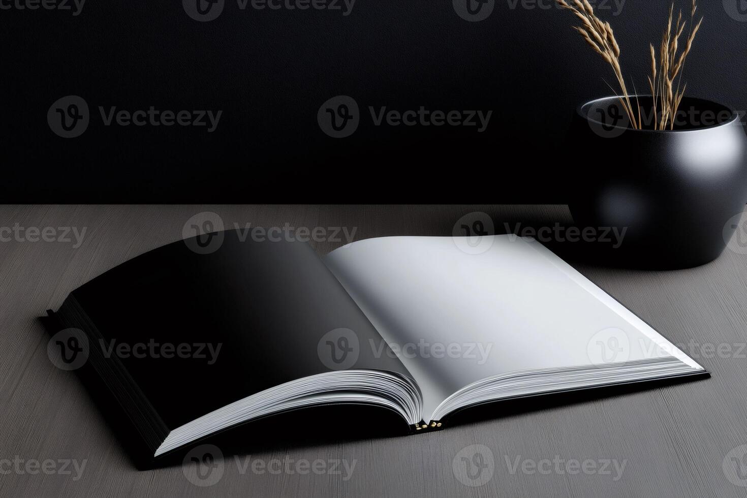Open book mockup lying on wooden table with black background photo