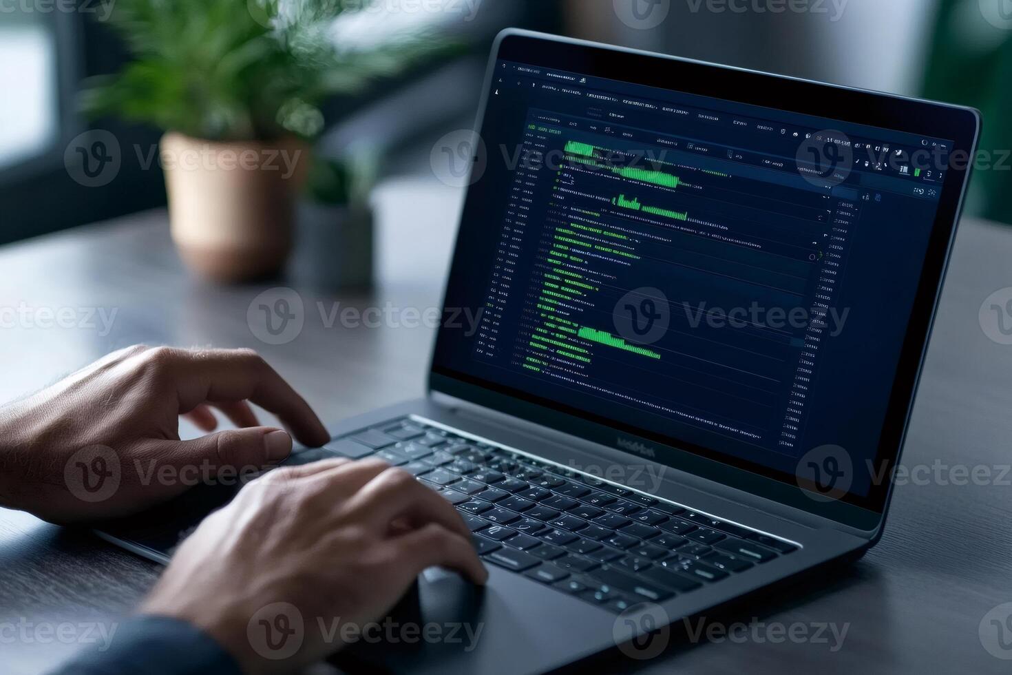 Programmer writing html and css code on a laptop computer photo