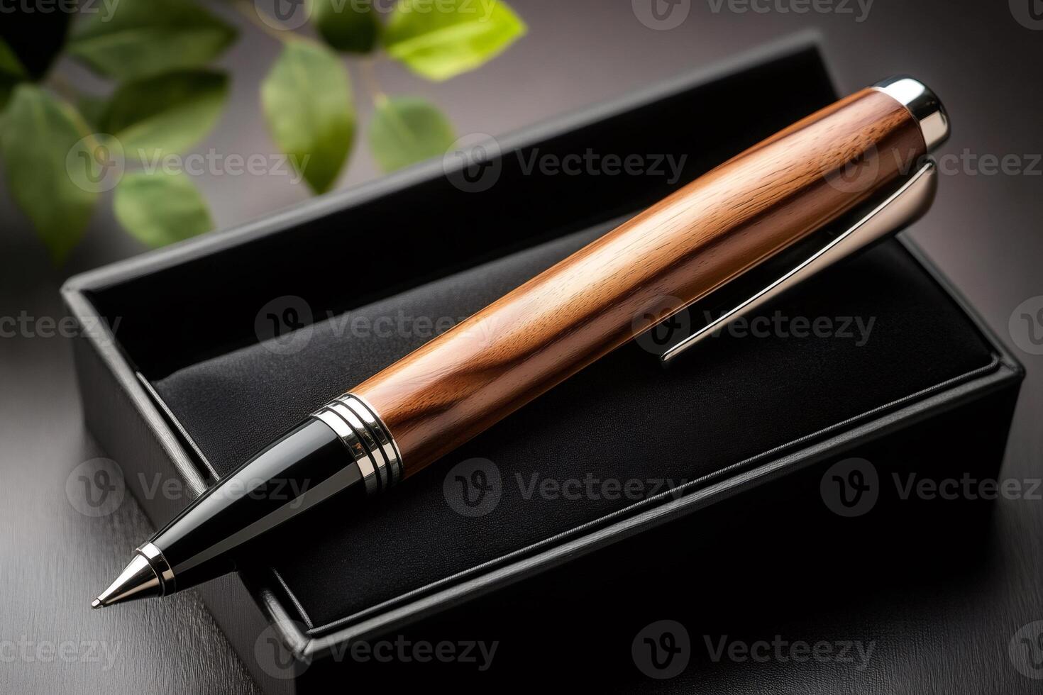 Elegant wooden ballpoint pen resting on black box photo