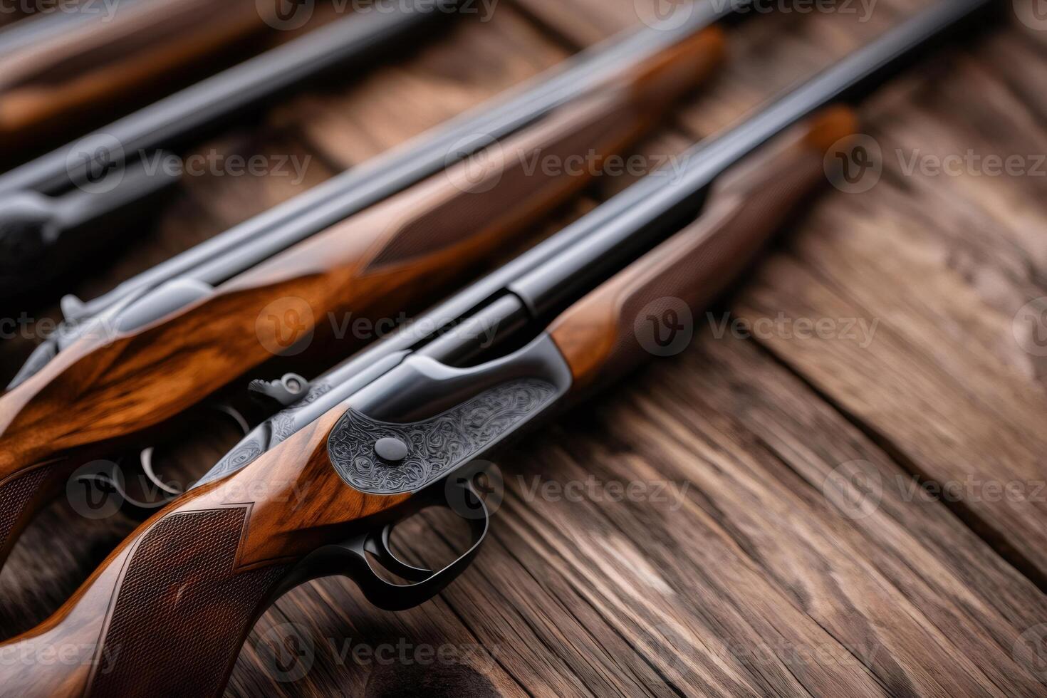 Hunting rifles with wooden stock resting on rustic table photo