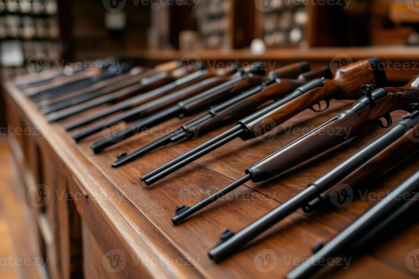 Hunting rifles displayed on wooden counter in gun shop photo