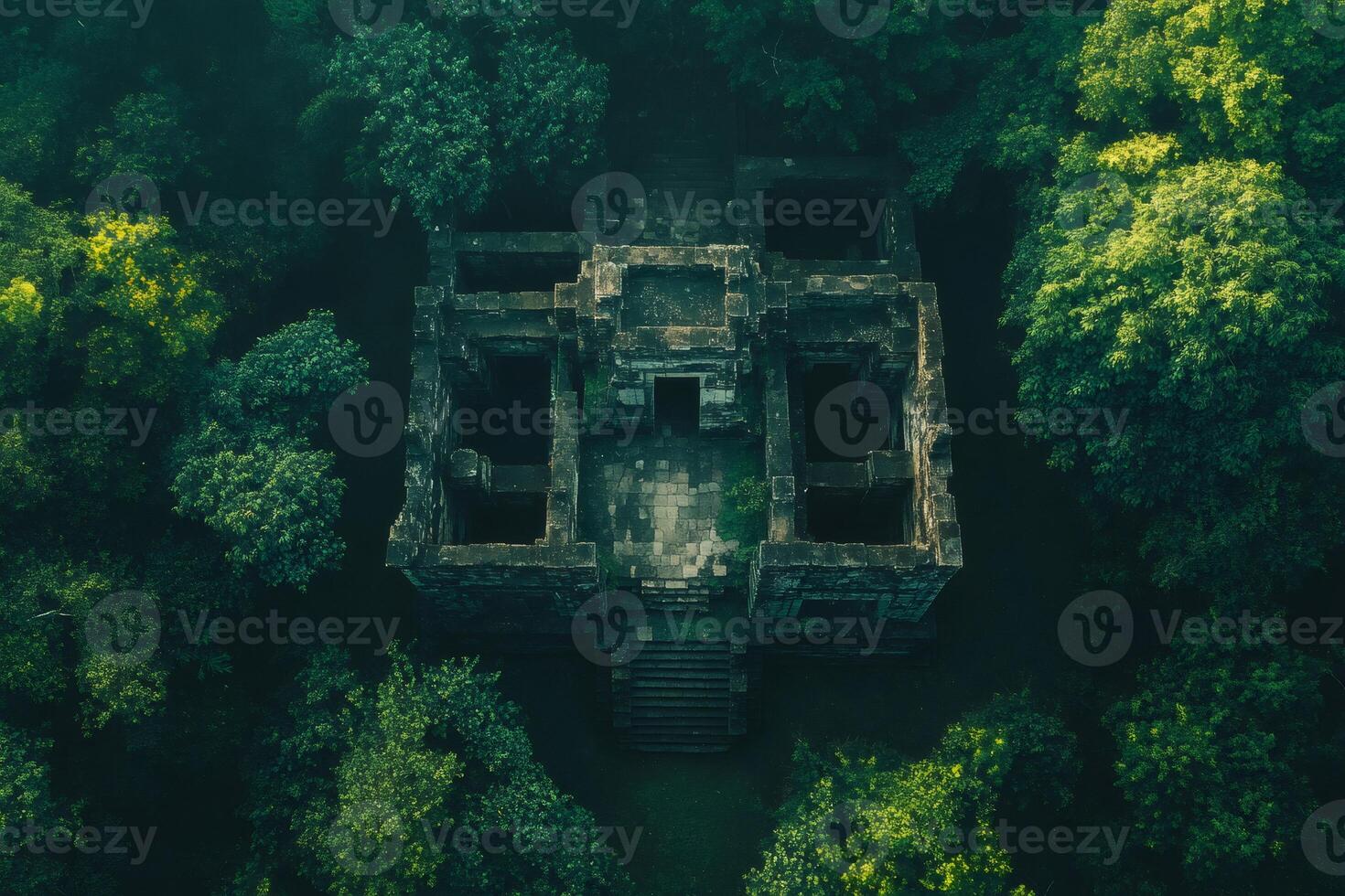 Koh ker temple ruins being reclaimed by lush jungle vegetation in cambodia photo