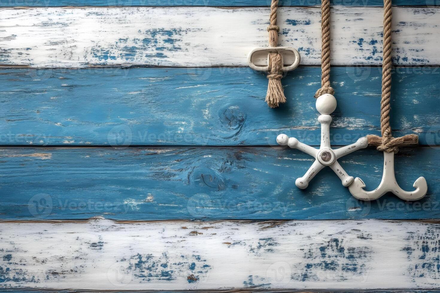 Decorative marine items hanging on rustic blue wooden wall photo