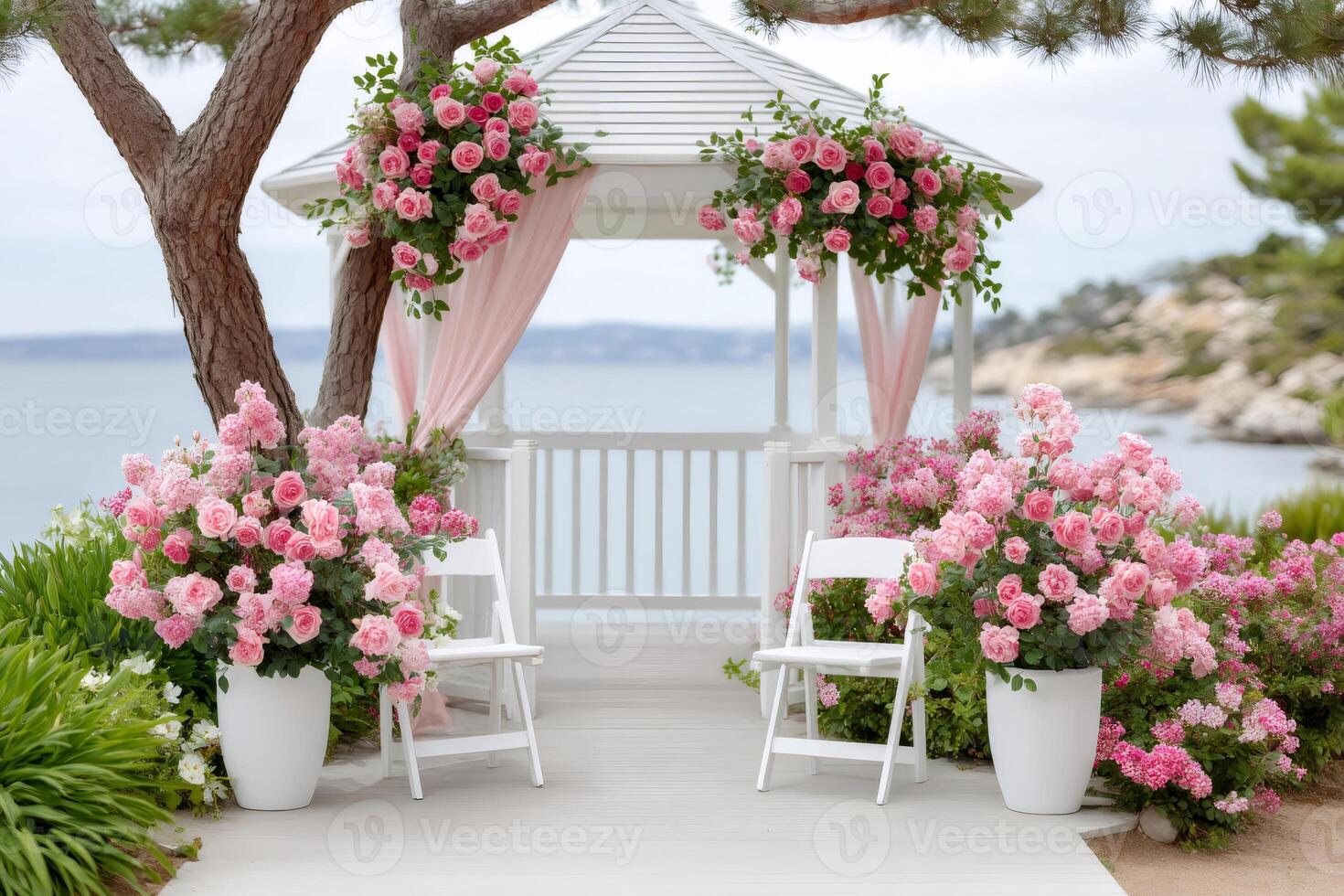 Romantic wedding gazebo decorated with pink roses overlooking the sea photo