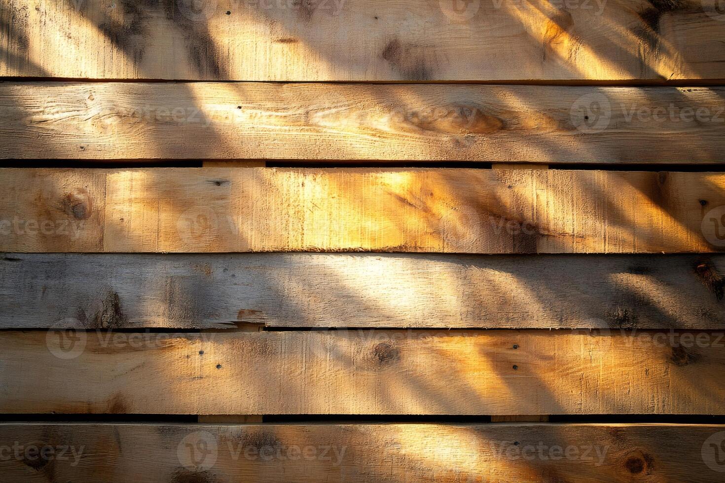 Sunlight creating shadows on wooden planks surface photo
