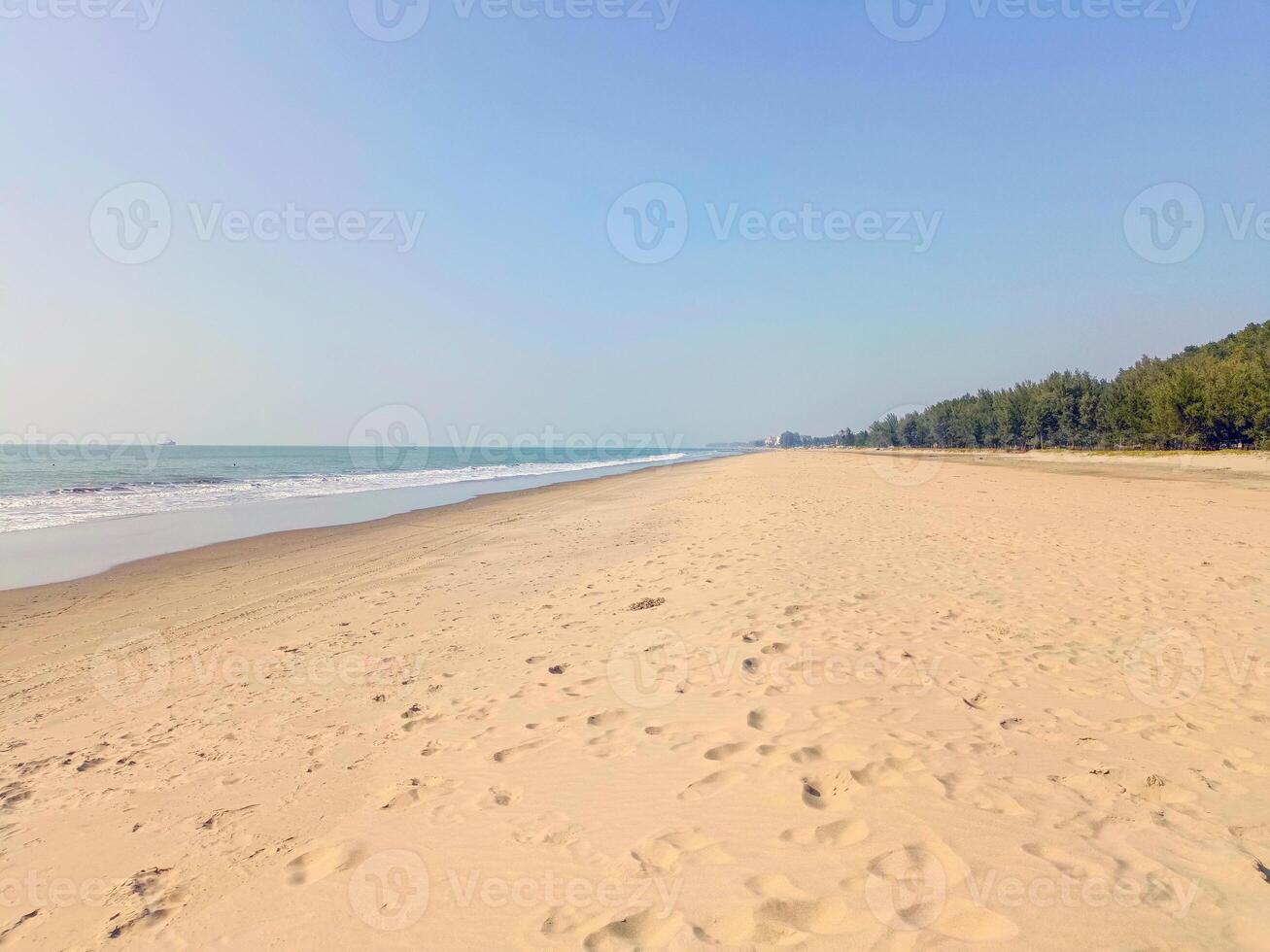 Ocean sand and water like desert view with Realistic summer background. beautiful hillside while the flawless sky adds contrast offering a simple yet powerful vision of outdoor harmony photo