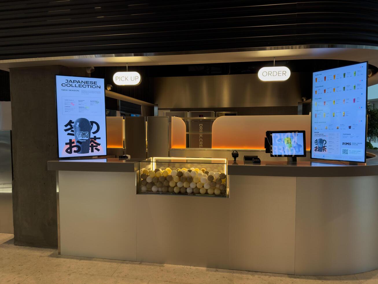 Moscow, Russia, April 25, 2025. Stylish PIMS cafe offers quick takeaway tea based drinks with modern design, attracting busy professionals seeking a vibrant and efficient refreshment experience photo