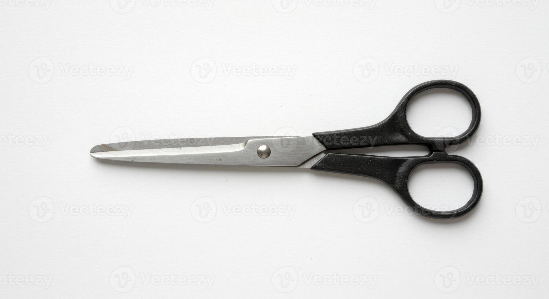 Black Handled Scissors on White Background photo