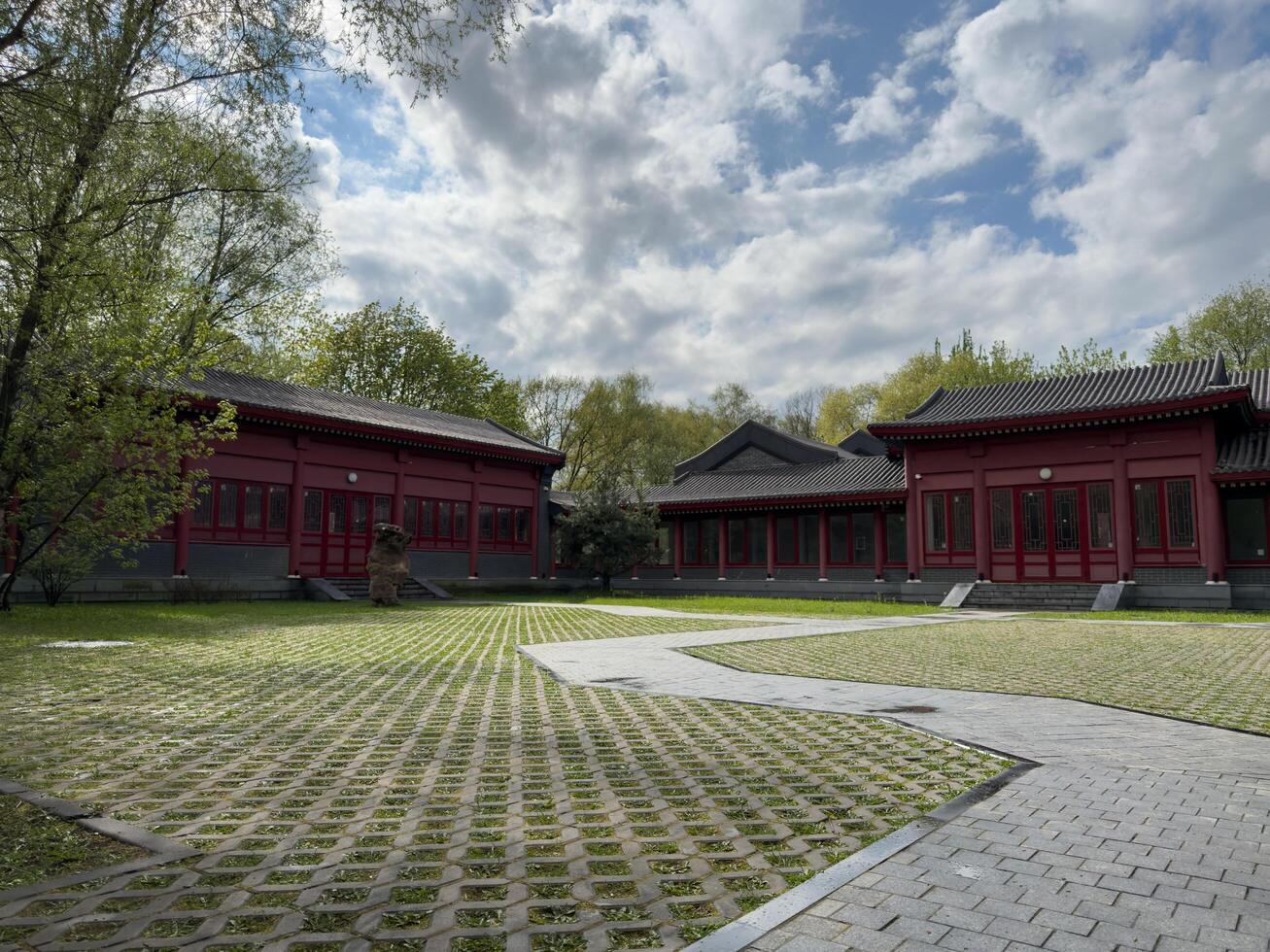 Moscow, Russia, April 25, 2025 Wide courtyard with gray paving stones and traditional Chinese style buildings in Huamin park. Calm space reflects cultural harmony and architectural elegance photo