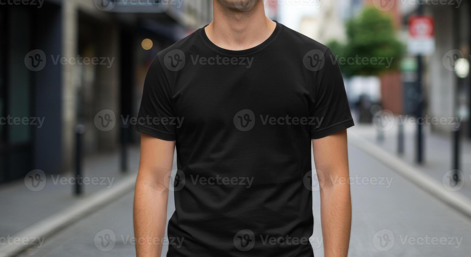 Model showcasing a simple black t-shirt mock up outdoors on a blurry street photo