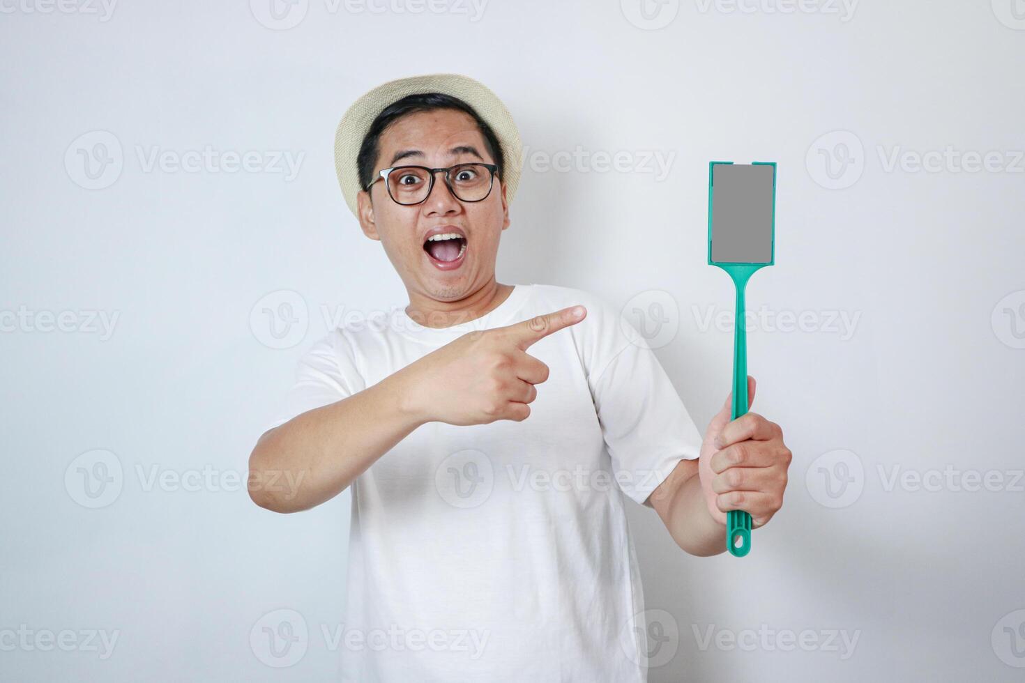 Asian man pointing stick e-toll with happy expression photo
