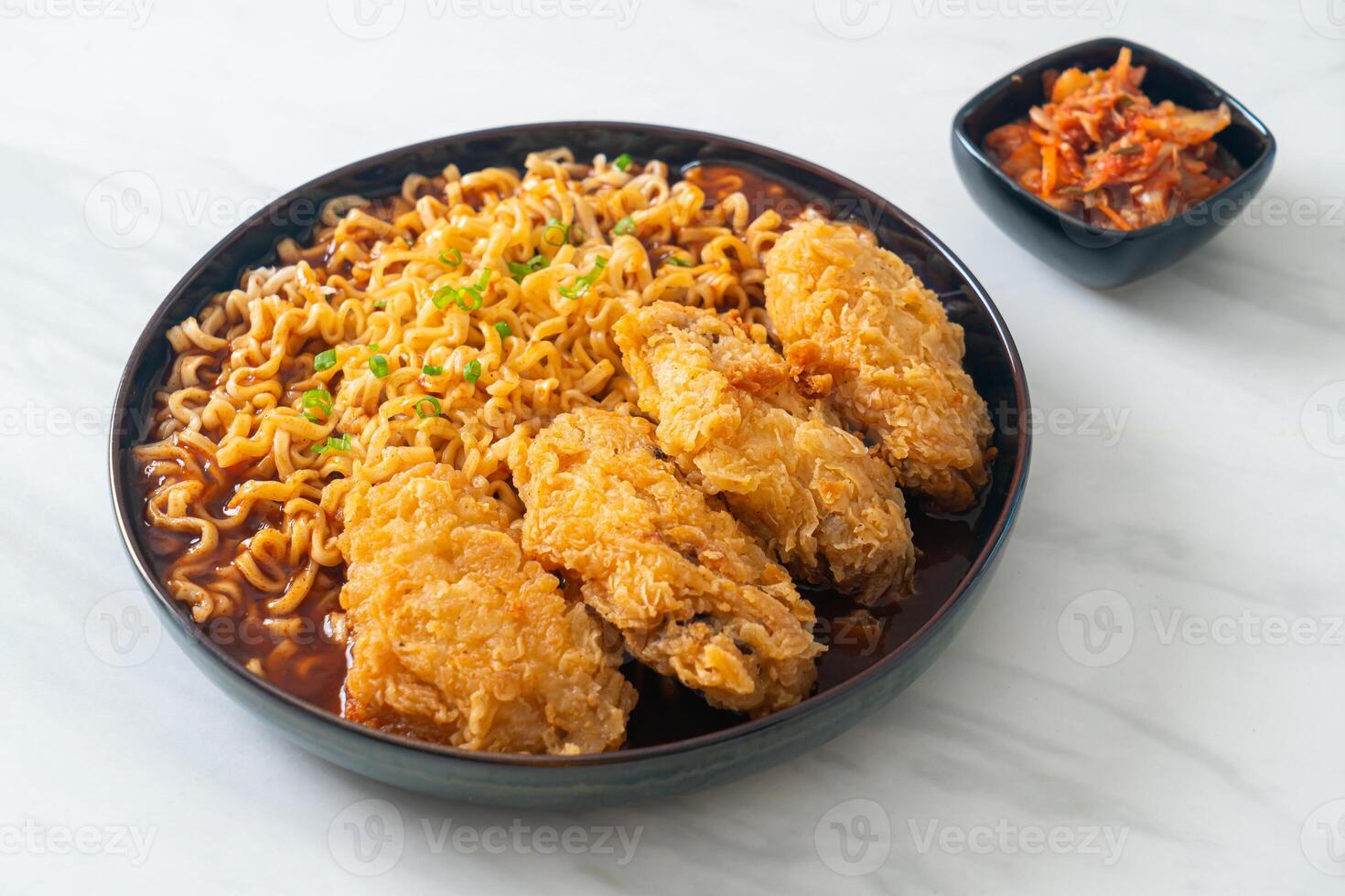Korean instant noodles with fried chicken or Fried chicken ramyeon - Asian food style photo
