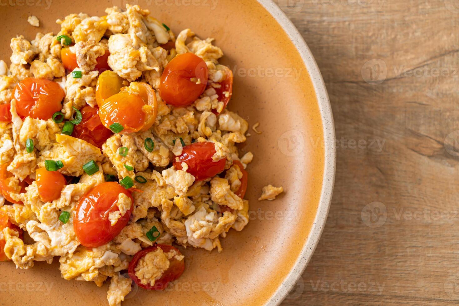 stir-fried tomatoes with egg on plate - Asian food style photo