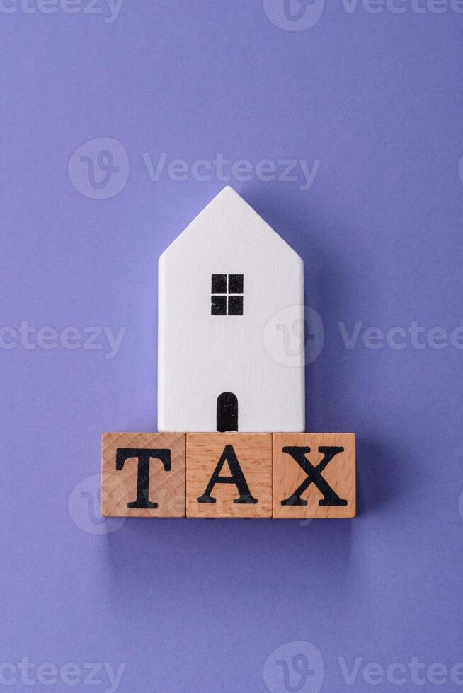 Tax on real estate, property, car or business. photo