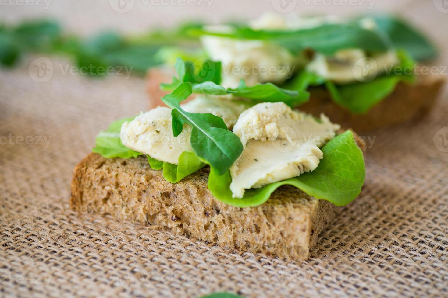 Appetizing sandwich with greens and fish spread . Simple breakfast. photo