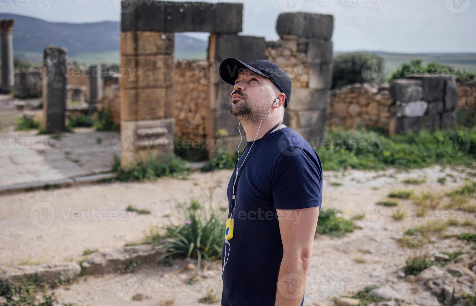 Tourist man in Volubilis, Morocco. An ancient city with a 2500-year history photo