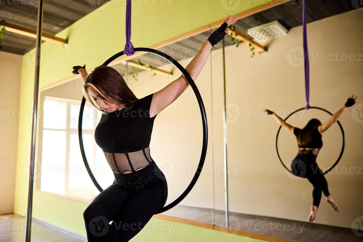 Woman Balancing On Aerial Hoop photo