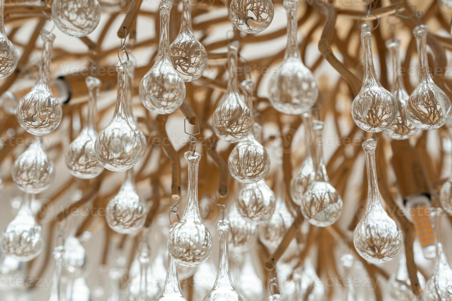 Intricate Glass Chandelier Decor with Hanging Ornaments photo