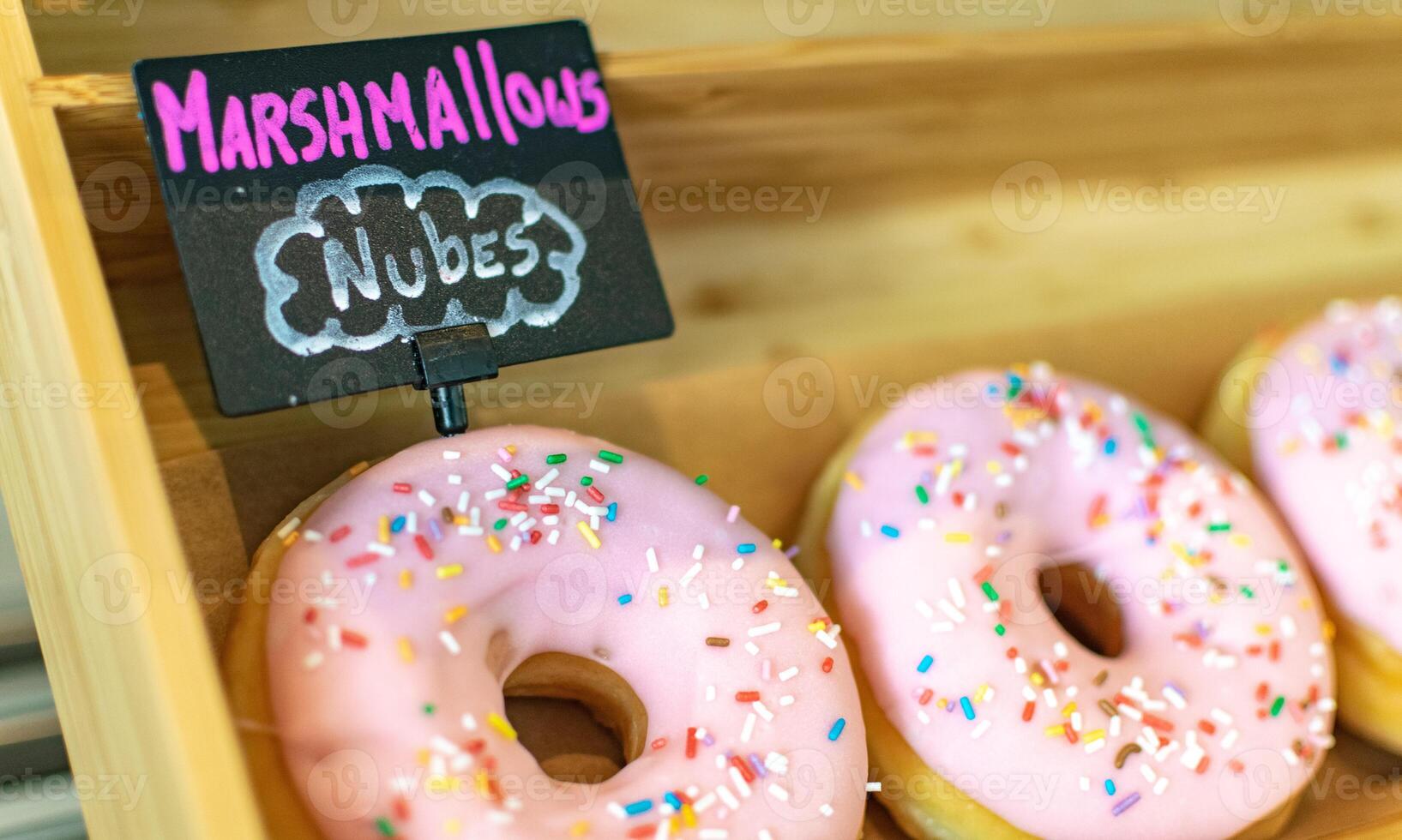 a close up image of marshmallow flavoured donut at a bakery photo