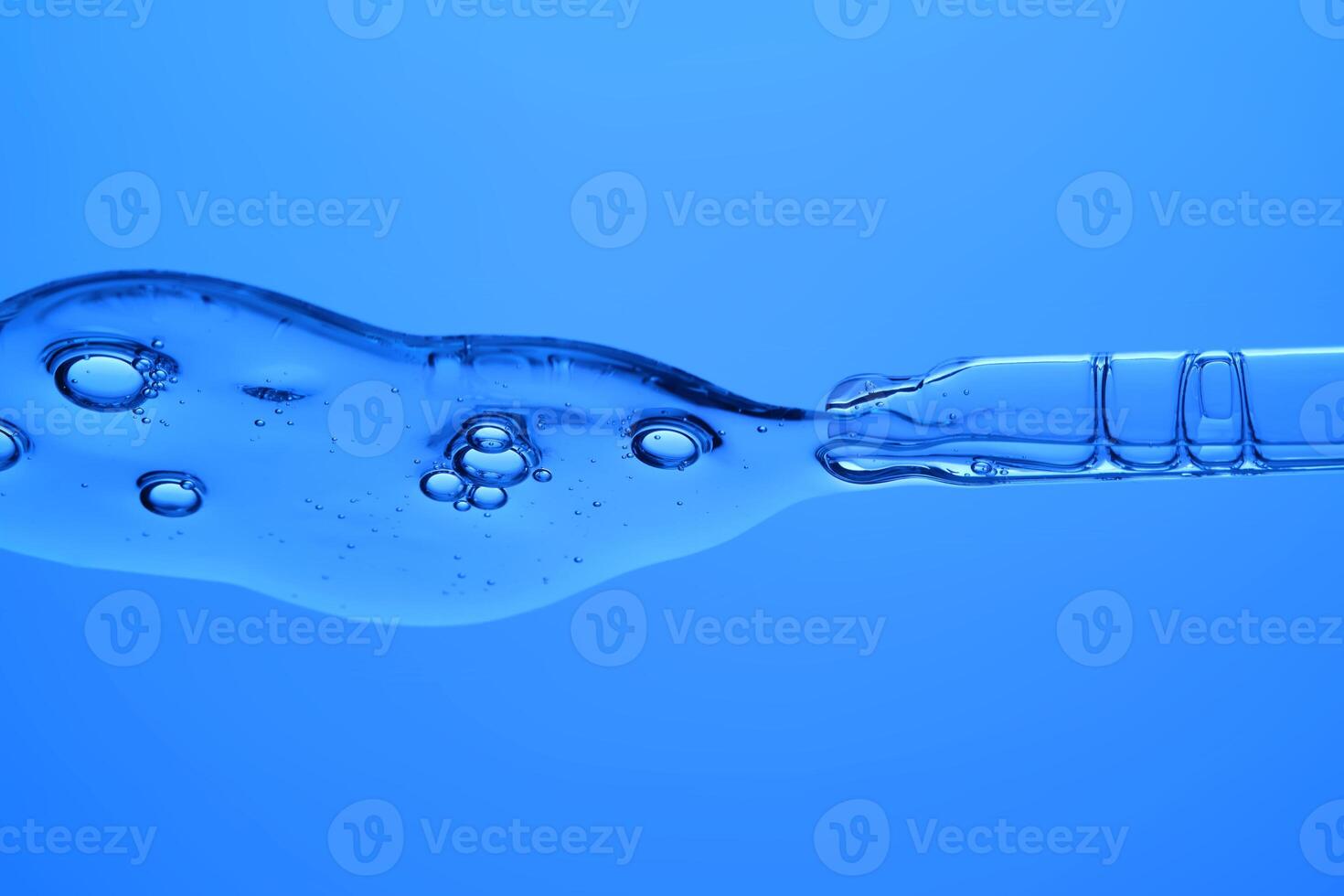 Anti-aging wrinkle serum on a blue background. photo