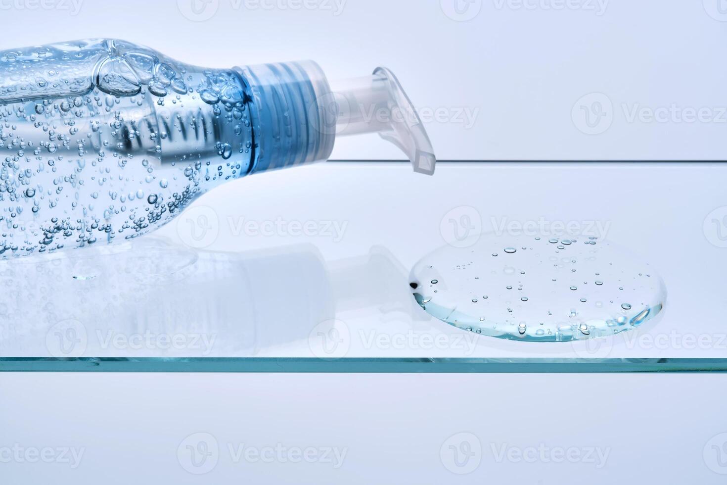 Micellar gel for cleansing the skin from makeup on a glass shelf. photo