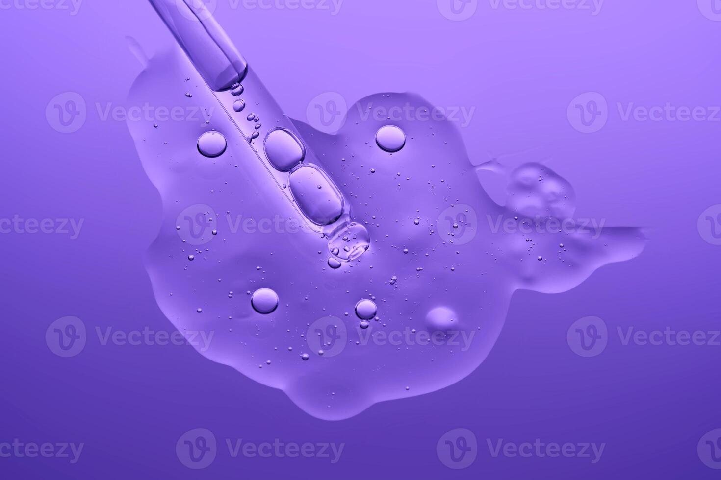 The texture of a serum with microneedles and a cosmetic pipette on a lilac background. photo