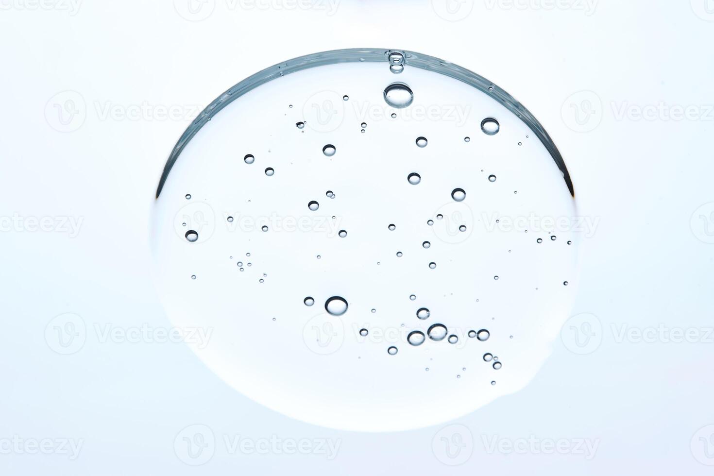 A drop of micellar cleansing gel for face wash on a blue background. photo