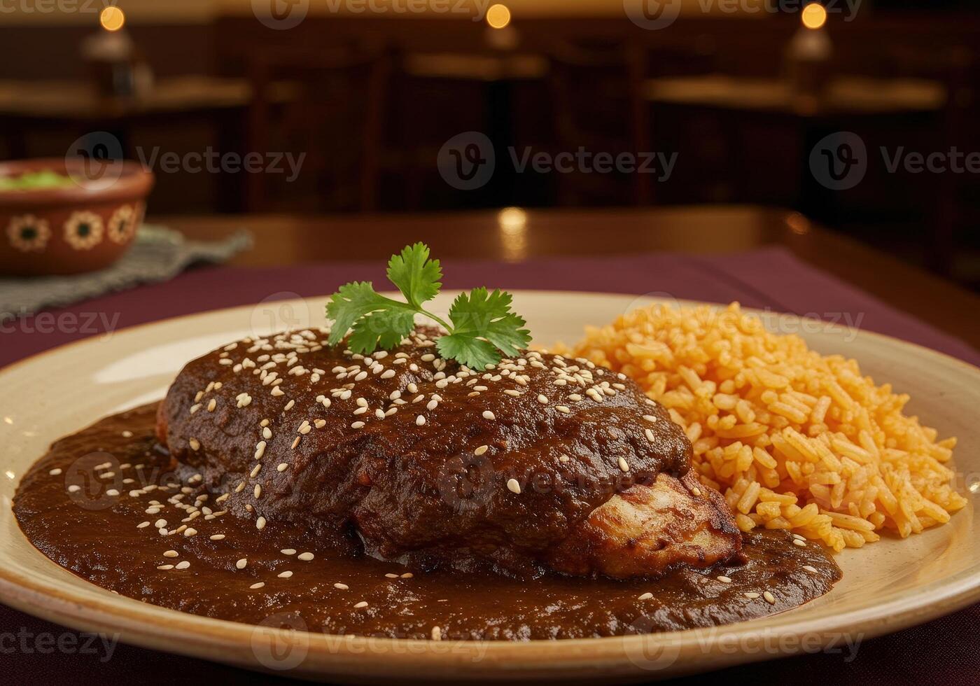 Authentic Mexican Mole Poblano chicken dish. Served on plate with rice photo