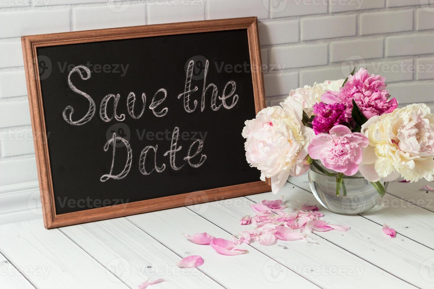 Invitation with bouquet of peonies and chalkboard photo