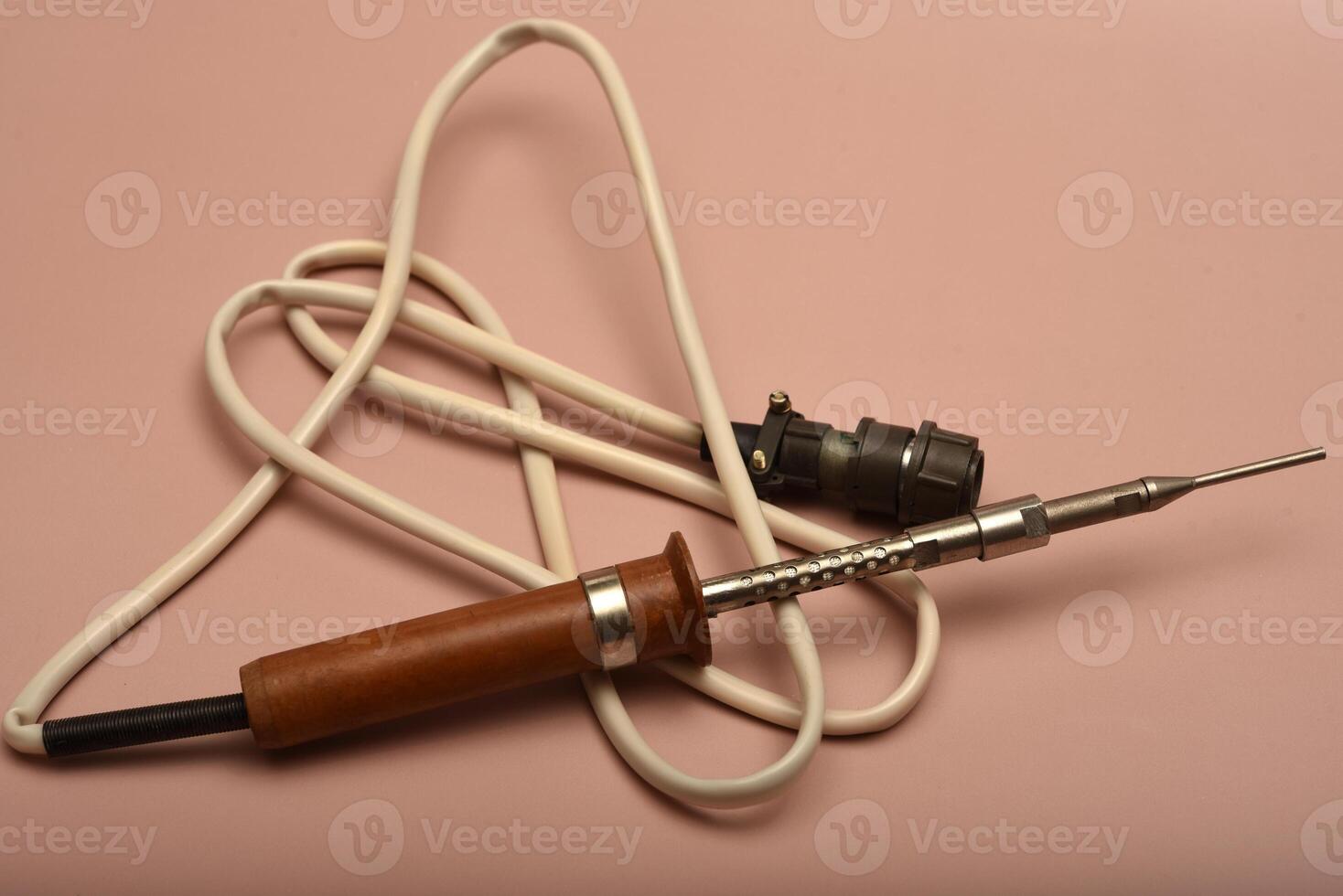 An antique soldering gadget showcasing a silver-coated end photo