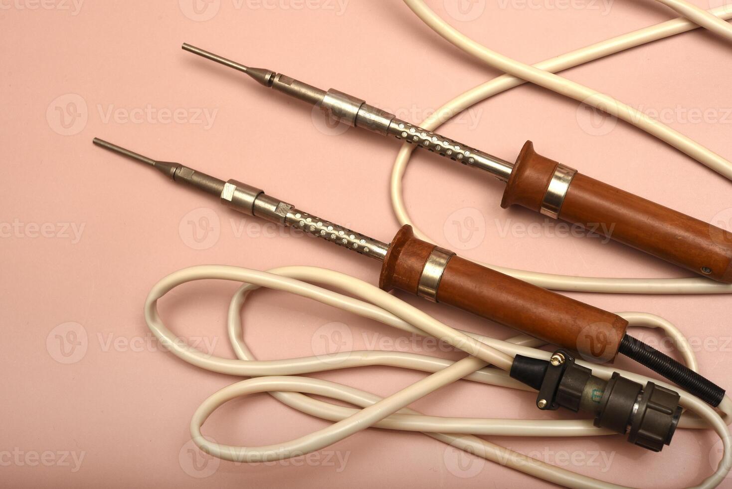 A historic soldering instrument with a silver head photo