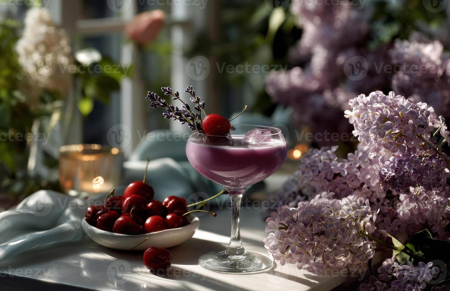 Elegant coupe glass with purple drink, cherries, and lavender garnish on a table photo