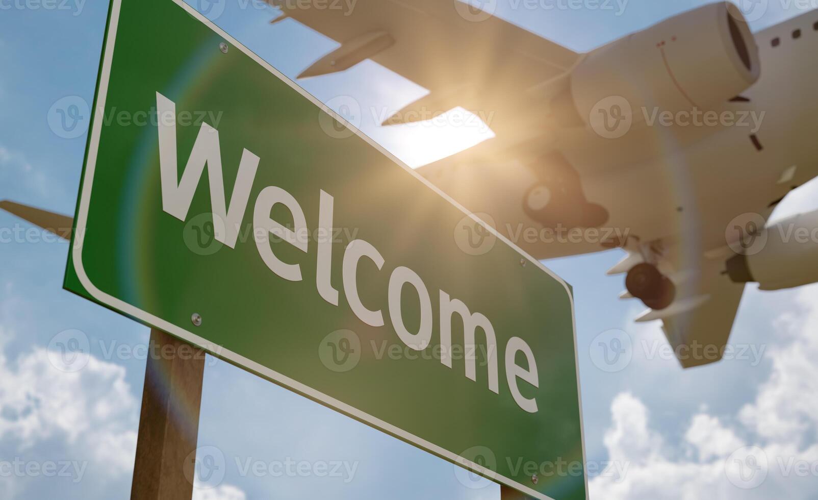 Welcome Green Road Sign with Airplane Above. photo