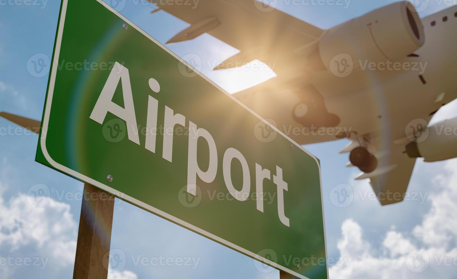Airport Green Road Sign with Low Flying Airplane Above. photo