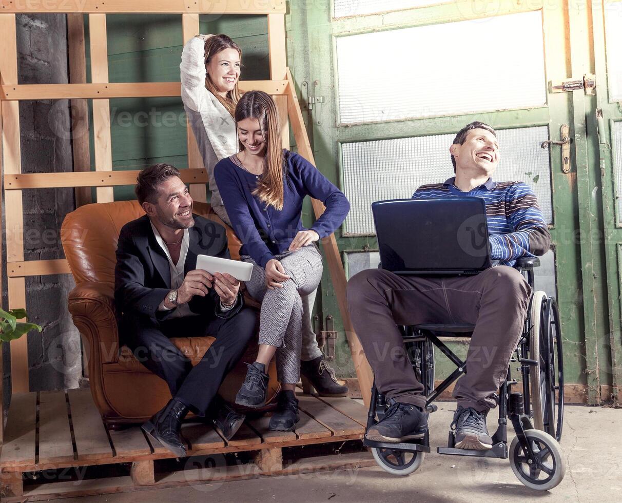 a team of young inclusive businessmen discussing working together for a new startup photo