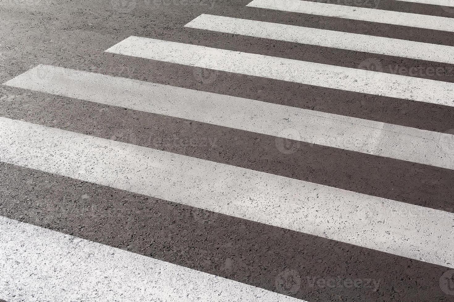 Crosswalk on the road for safety when people walking cross the street photo