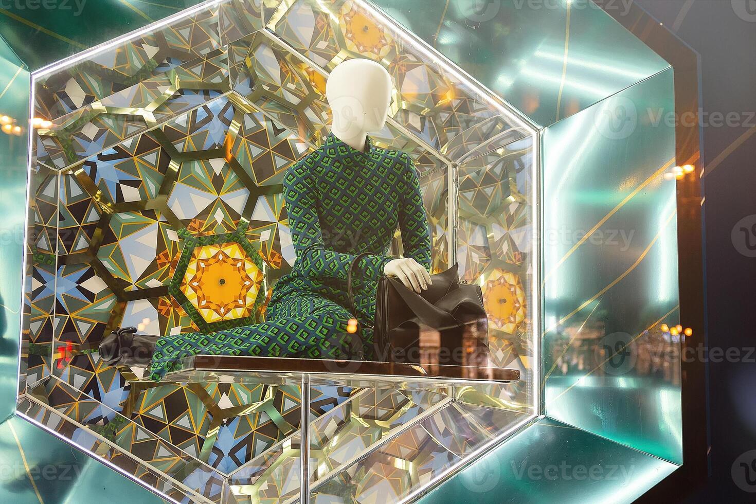 Mannequin in a magnificent luxurious dress in a shop window photo