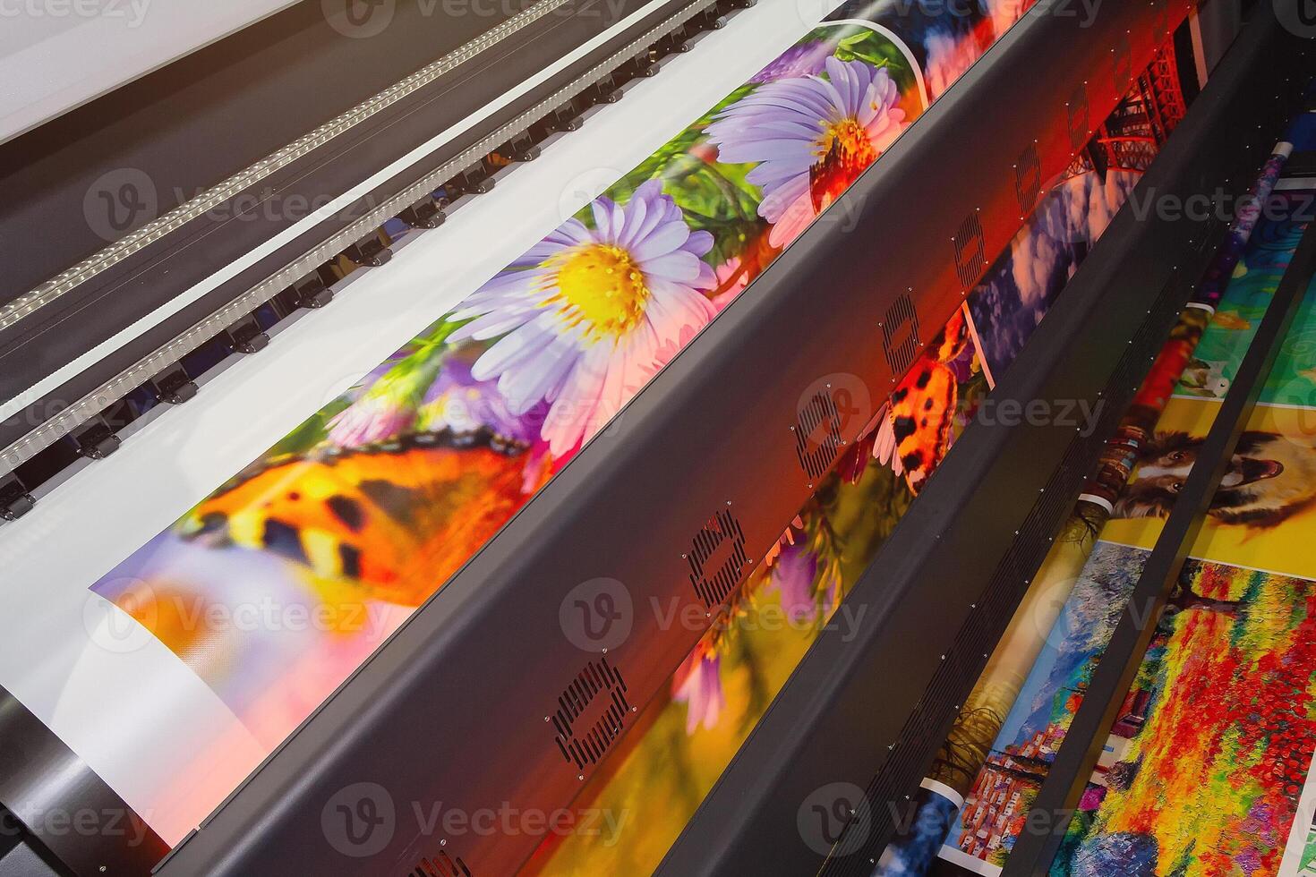 Large format printing machine in operation close-up photo