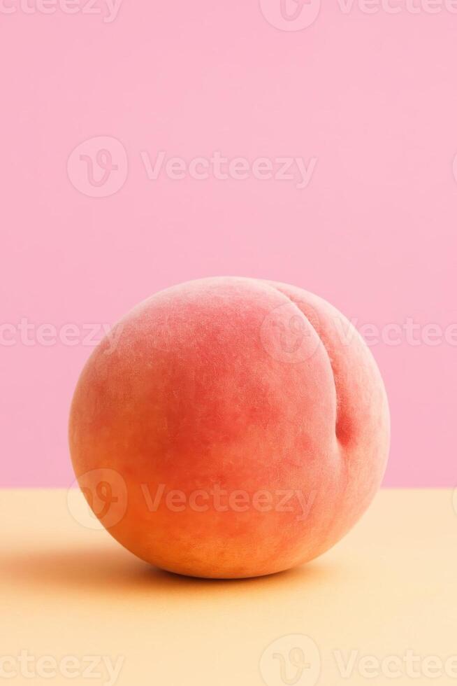 Minimalist studio shot of a single ripe peach standing upright on a flat pastel orange surface, against a soft pink background, high-resolution macro photography photo