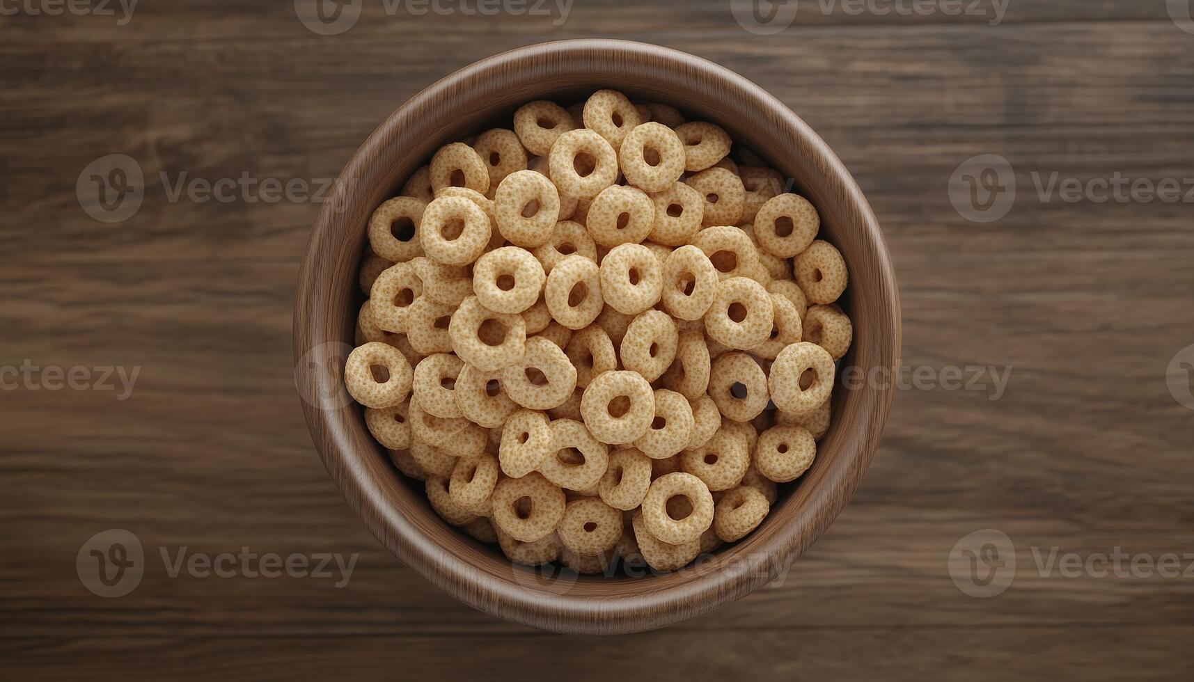 Cereal rounded ring wholegrain and on wooden bowl in brown table dark background photo