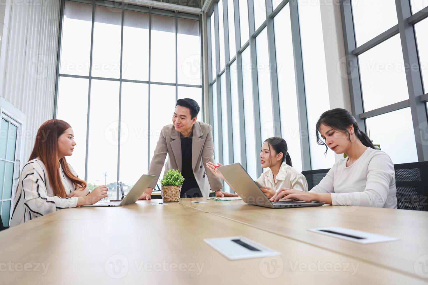 Team Collaboration in Modern Office Meeting, Business Colleagues Brainstorming Together at Work, Startup Team Planning Project During Office Meeting photo