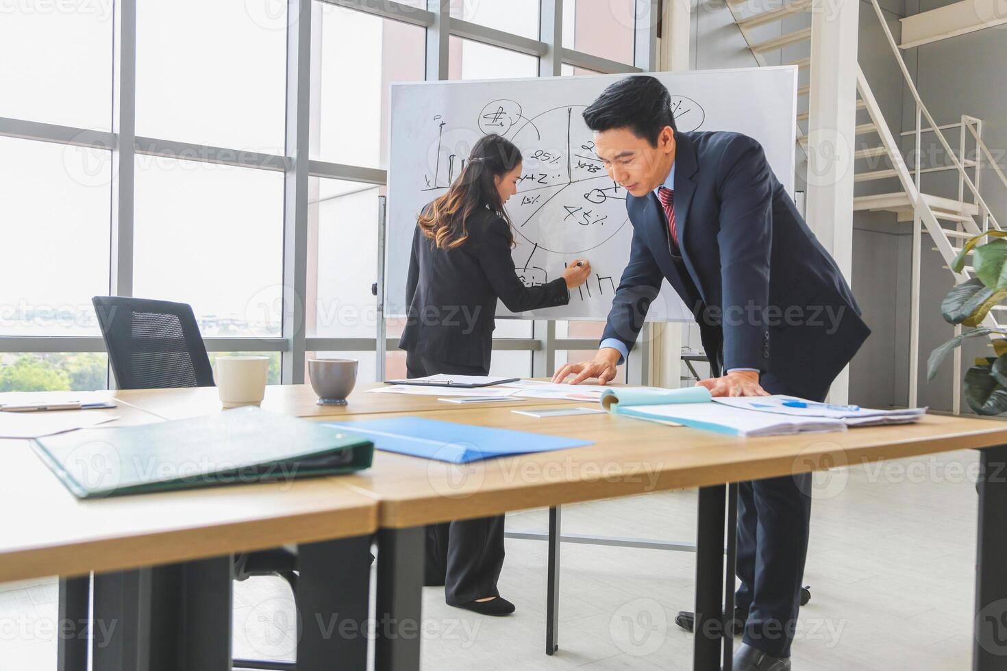 Businesspeople meeting in modern office, Professional business meeting in office environment, Teamwork and brainstorming concepts photo