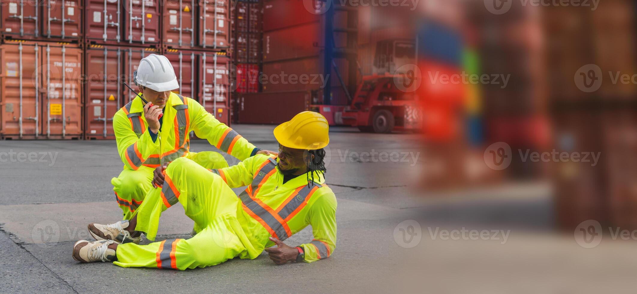 Foreman dock workers taking care about their colleague lying on the floor at shipping yard, Accident at work concepts photo