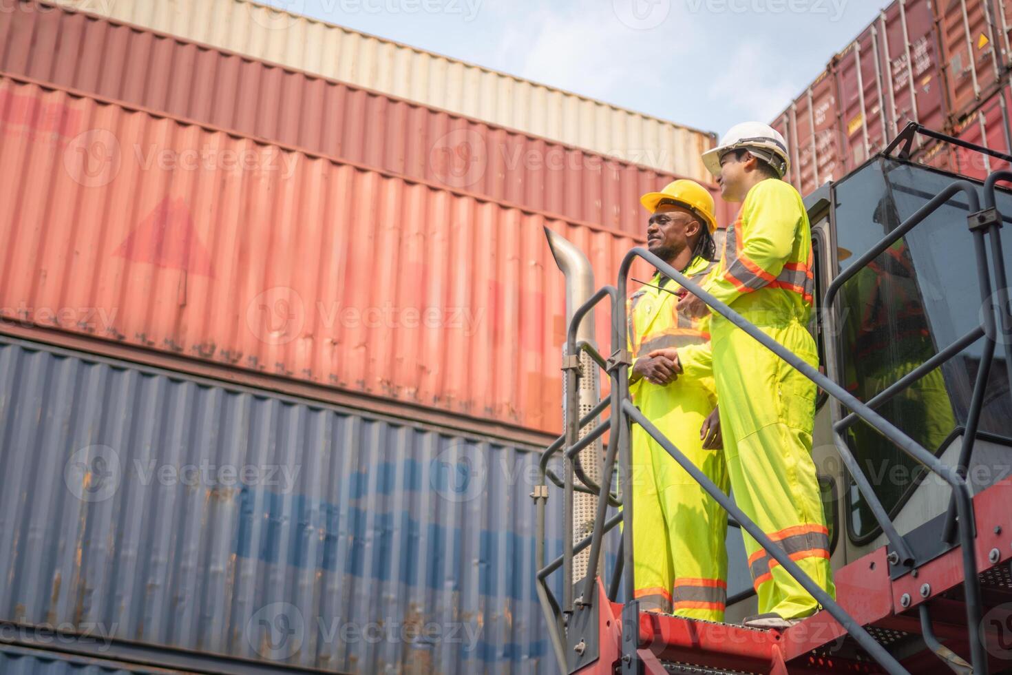 Engineer man Team in Safety Gear Control Containers Box at Container Cargo, Yard Workers Team Discussion at Shipping Yard photo